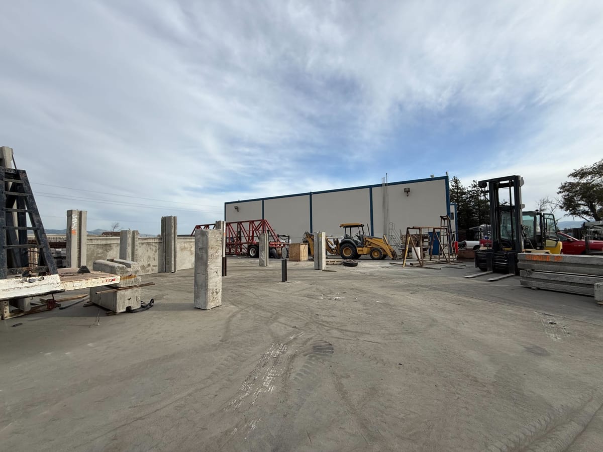 American Precast Concrete Pomona CA facility yard with forklifts and precast panels