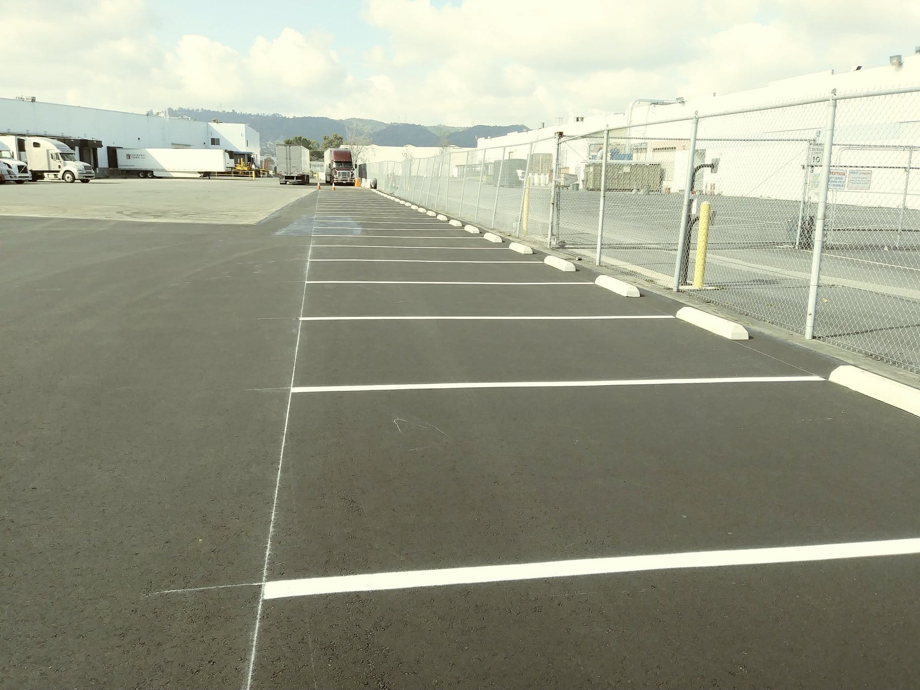 APC wheel stops installed at a commercial parking facility